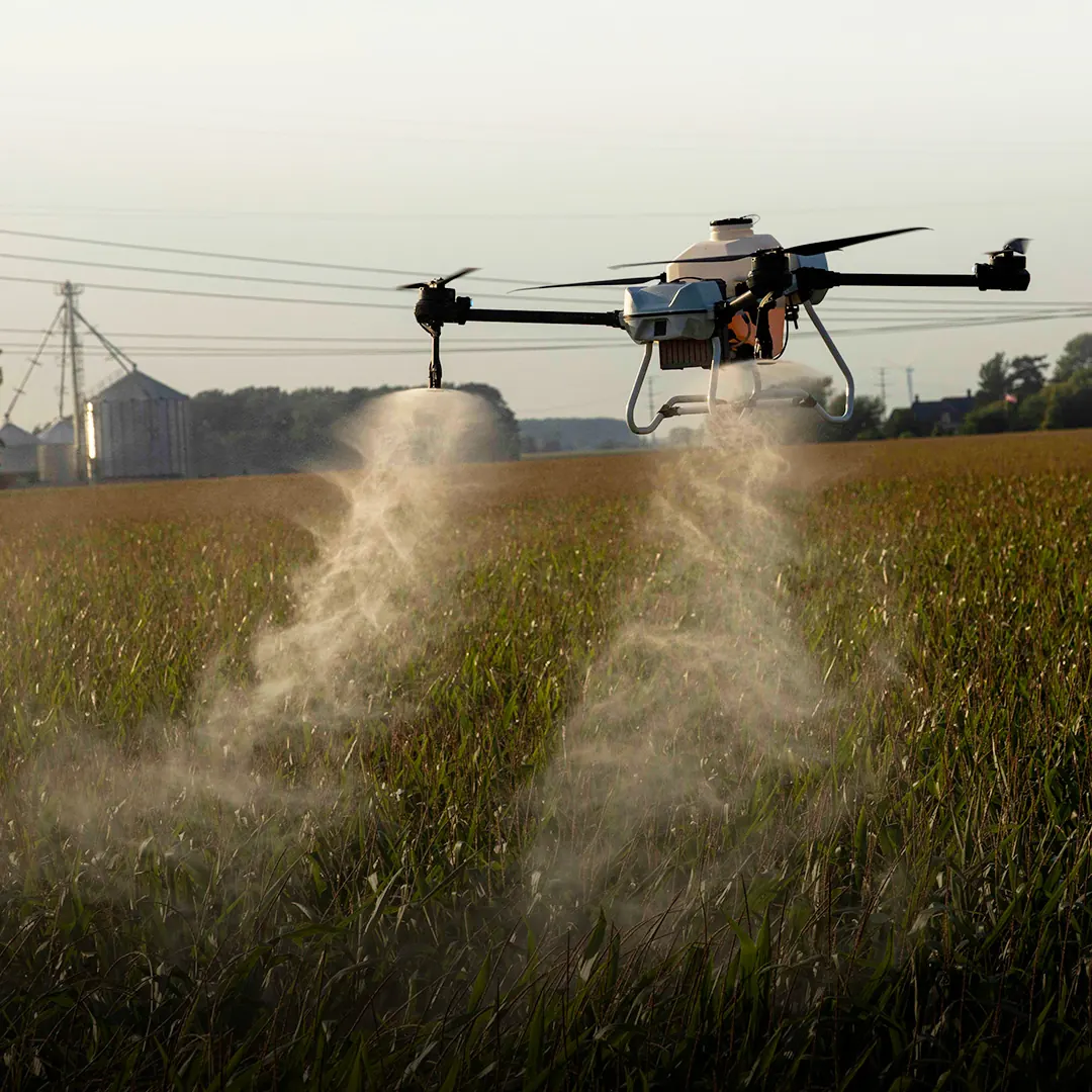 Ayre CX spraying a field at dawn